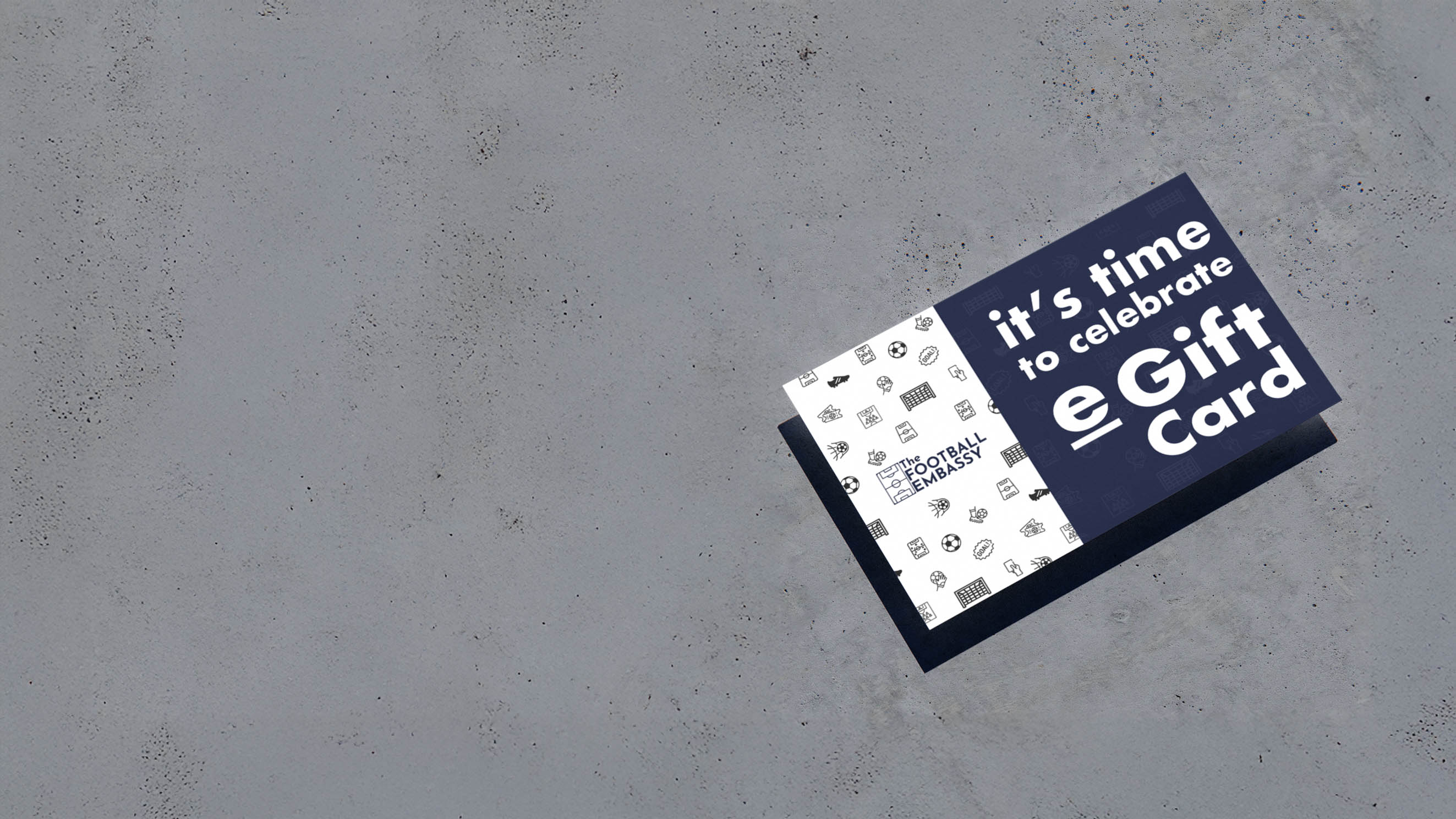 Gift card with 'it's time to celebrate eGift Card' text on a concrete surface