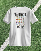 White t-shirt with 'World Cup Mascots' design on a grass background