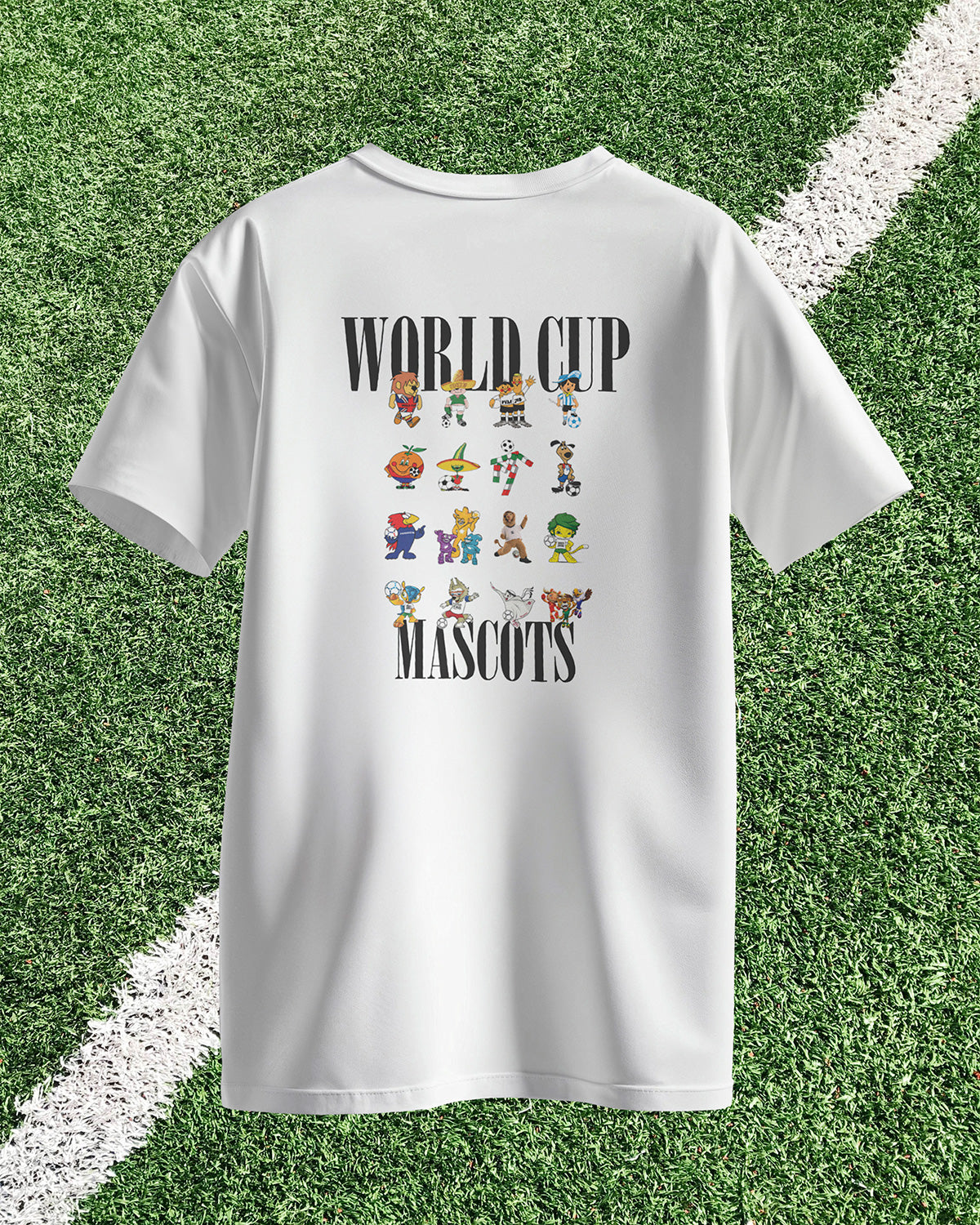 White t-shirt with 'World Cup Mascots' design on a grass background